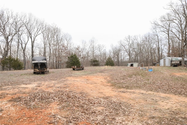 25125 Ash Dr, Grovespring, MO 65662 - view of yard with a shed and an outbuilding