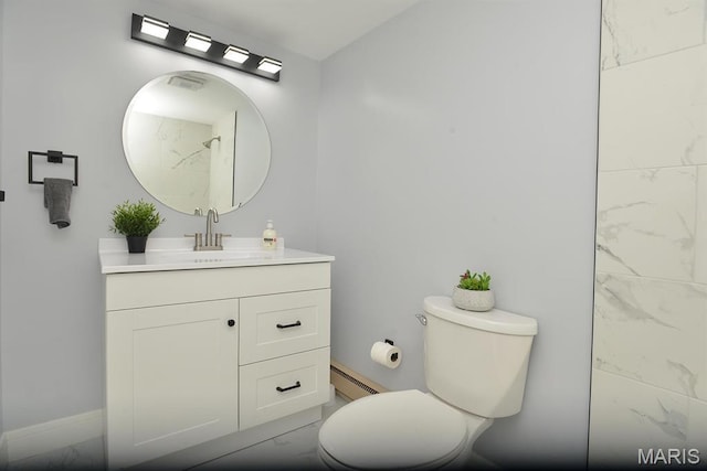 1680 Herault Pl Unit F, Saint Louis, MO 63125 - bathroom with baseboard heating, toilet, vanity, marble finish flooring, and baseboards