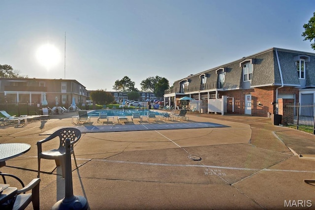 1680 Herault Pl Unit F, Saint Louis, MO 63125 - community pool featuring a patio area and fence