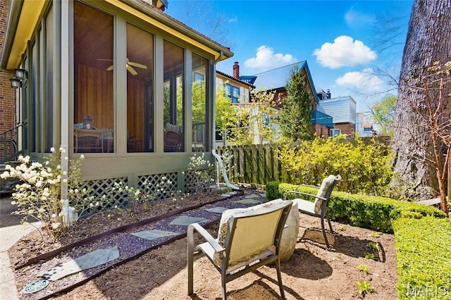 view of patio featuring a sunroom