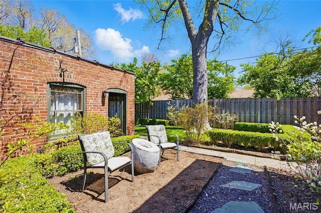 view of yard with fence and a patio