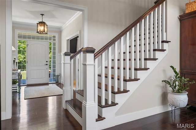 1178 Turnberry Dr, Innsbrook, MO 63390 - foyer with dark wood-style floors, ornamental molding, stairs, and baseboards