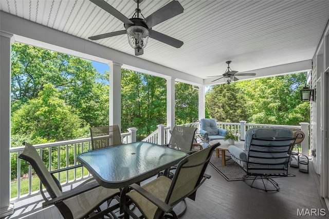 1178 Turnberry Dr, Innsbrook, MO 63390 - deck featuring a ceiling fan, outdoor dining area, an outdoor hangout area, and view of scattered trees