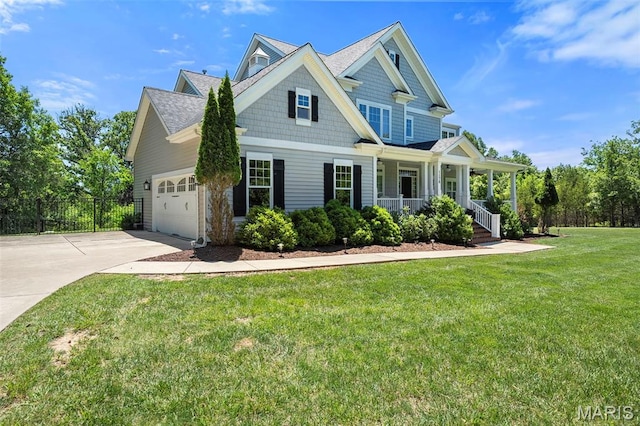 1178 Turnberry Dr, Innsbrook, MO 63390 - craftsman-style home with covered porch, concrete driveway, a garage, and a shingled roof