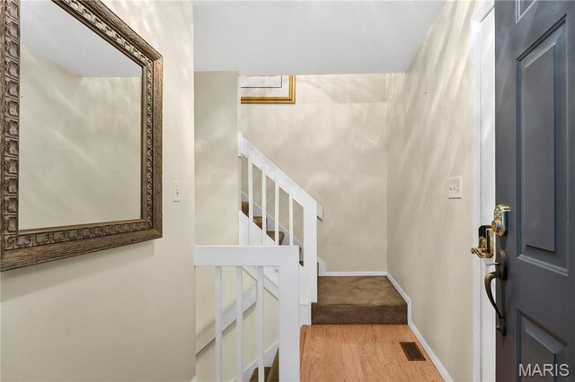 3110 Autumn Shores Dr, Maryland Heights, MO 63043 - foyer entrance featuring stairway, wood finished floors, and baseboards