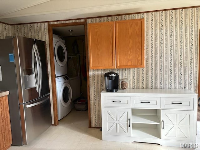 8336 Cedar Fork Rd, New Haven, MO 63068 - washroom with stacked washing machine and dryer and wallpapered walls
