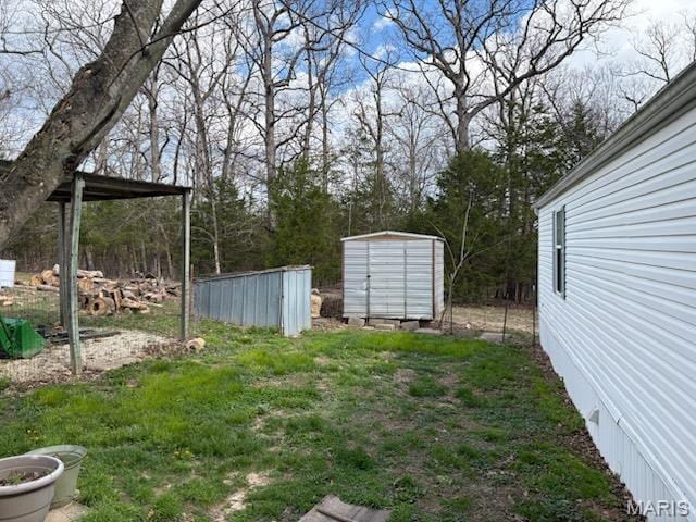 8336 Cedar Fork Rd, New Haven, MO 63068 - view of yard with a storage unit and an outdoor structure