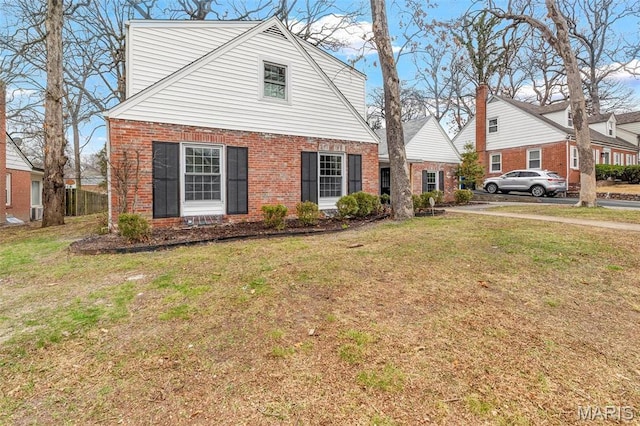 83 Chafford Woods, Saint Louis, MO 63144 - view of front facade with brick siding and a front lawn