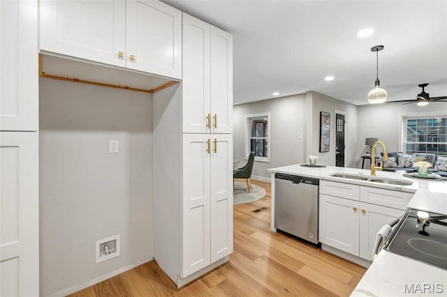 83 Chafford Woods, Saint Louis, MO 63144 - kitchen with stainless steel dishwasher, light wood-style flooring, white cabinetry, recessed lighting, and hanging light fixtures