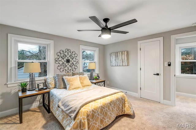 83 Chafford Woods, Saint Louis, MO 63144 - bedroom with multiple windows, light carpet, and ceiling fan