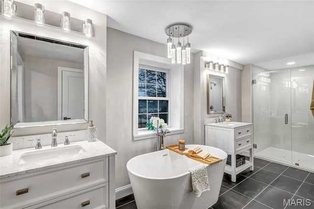 83 Chafford Woods, Saint Louis, MO 63144 - full bath featuring a stall shower, two vanities, a soaking tub, tile patterned floors, and a chandelier