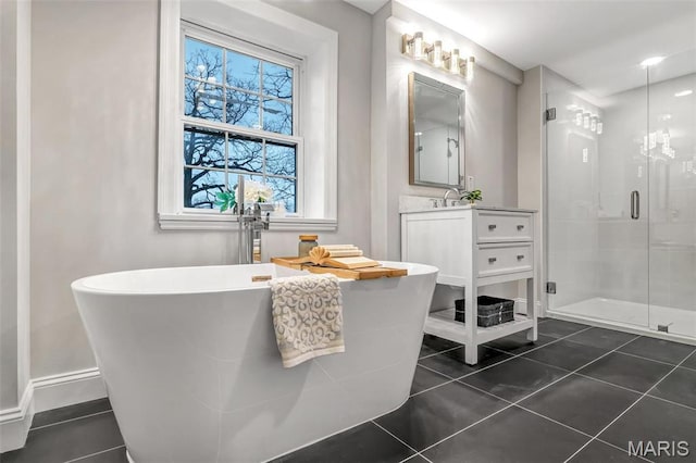 83 Chafford Woods, Saint Louis, MO 63144 - bathroom featuring a shower stall, vanity, tile patterned floors, and a soaking tub