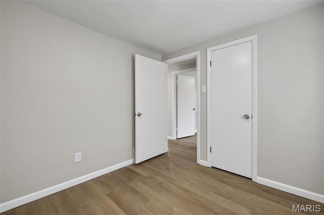 9515 Edmund Ave, Saint Louis, MO 63114 - spare room featuring wood finished floors and baseboards