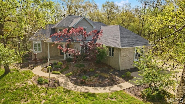 view of front of property with covered porch and brick siding