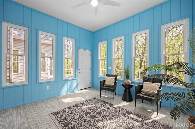 sitting room featuring plenty of natural light, carpet floors, and ceiling fan
