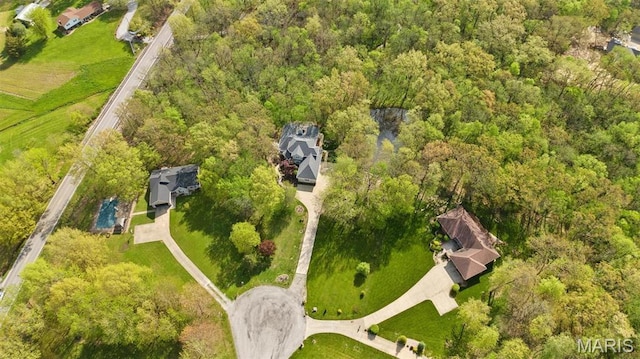 drone / aerial view of a heavily wooded area