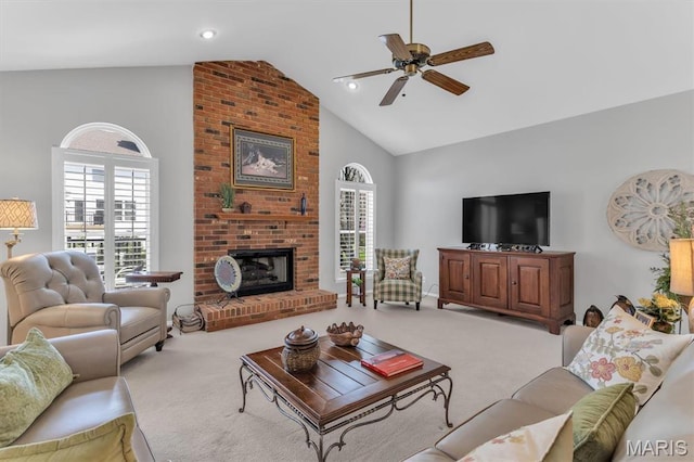 13463 Keller Ridge Cv, Saint Louis, MO 63128 - living area with carpet, ceiling fan, healthy amount of natural light, high vaulted ceiling, and a fireplace