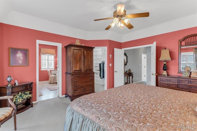 13463 Keller Ridge Cv, Saint Louis, MO 63128 - bedroom featuring multiple windows, carpet floors, ensuite bath, and ceiling fan