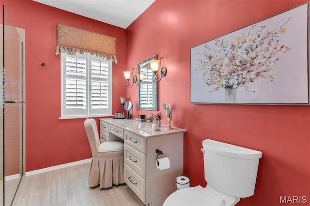 13463 Keller Ridge Cv, Saint Louis, MO 63128 - bathroom featuring toilet, a shower with shower door, vanity, and baseboards