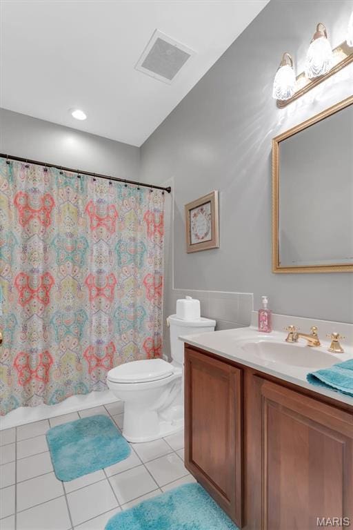 13463 Keller Ridge Cv, Saint Louis, MO 63128 - full bath featuring toilet, tile patterned flooring, vanity, and shower / bath combo with shower curtain