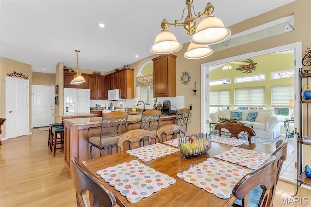 13463 Keller Ridge Cv, Saint Louis, MO 63128 - dining space featuring light wood-style floors and a chandelier