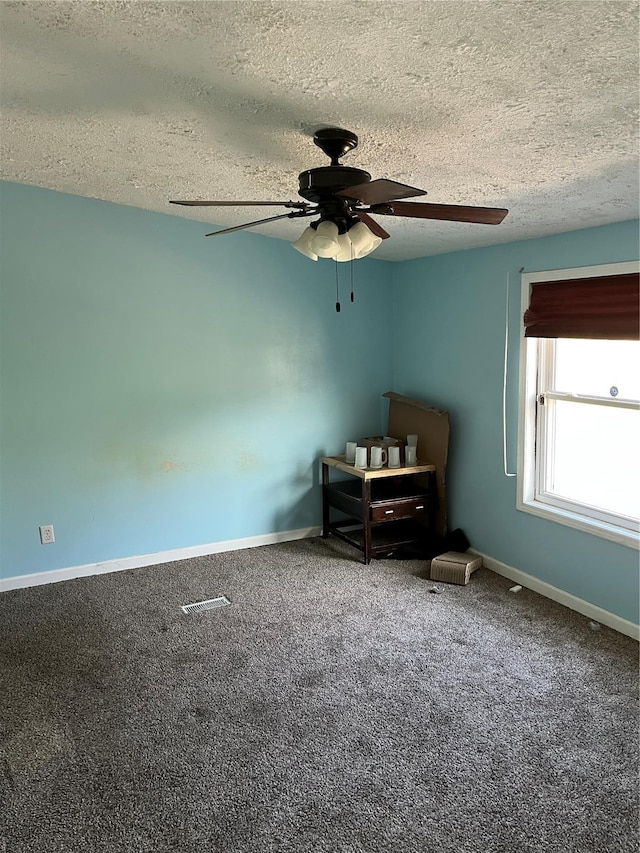 2717 Creon Ct, De Soto, MO 63020 - carpeted bedroom featuring a textured ceiling, baseboards, and ceiling fan