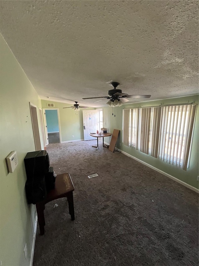 2717 Creon Ct, De Soto, MO 63020 - unfurnished living room featuring carpet, ceiling fan, a textured ceiling, and baseboards