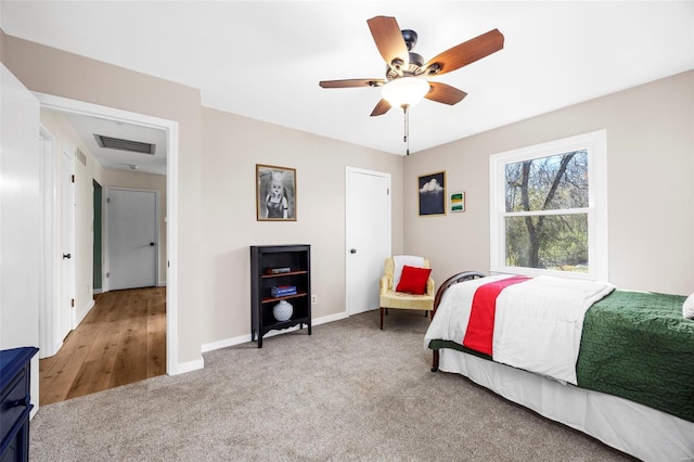 1300 Hudson Rd, Saint Louis, MO 63135 - bedroom with carpet flooring, baseboards, and a ceiling fan