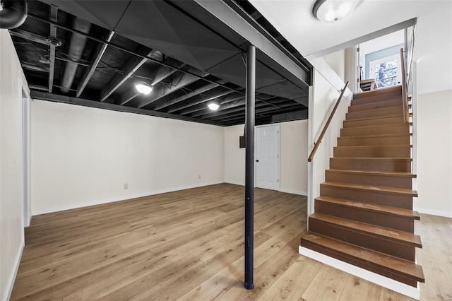1300 Hudson Rd, Saint Louis, MO 63135 - basement with stairs, wood-type flooring, and baseboards