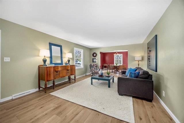 1300 Hudson Rd, Saint Louis, MO 63135 - living room with wood finished floors and baseboards