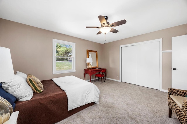 1300 Hudson Rd, Saint Louis, MO 63135 - carpeted bedroom with a closet, a ceiling fan, and baseboards