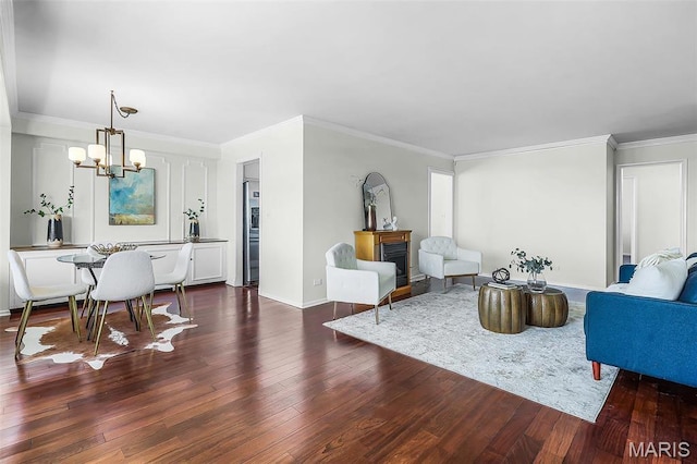 4466 W Pine Blvd Unit 23C, Saint Louis, MO 63108 - living area with a chandelier, wood finished floors, a fireplace, and ornamental molding