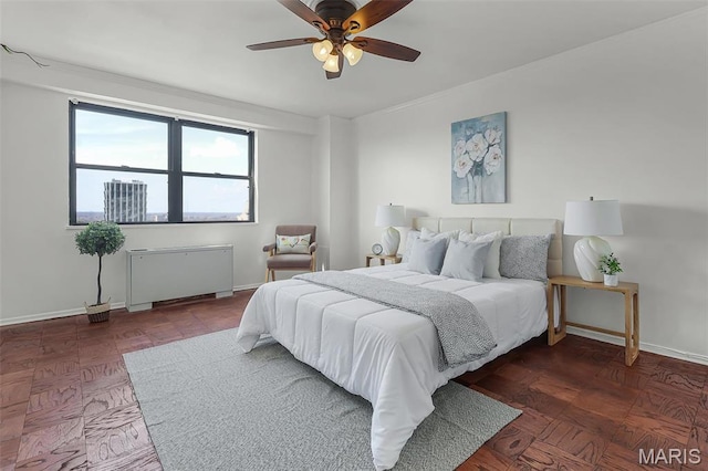 4466 W Pine Blvd Unit 23C, Saint Louis, MO 63108 - bedroom with radiator heating unit, baseboards, a ceiling fan, and crown molding