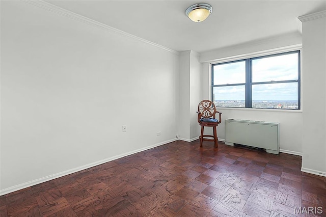 4466 W Pine Blvd Unit 23C, Saint Louis, MO 63108 - spare room with radiator, baseboards, and ornamental molding