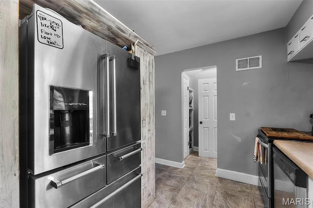 kitchen featuring stainless steel appliances and baseboards