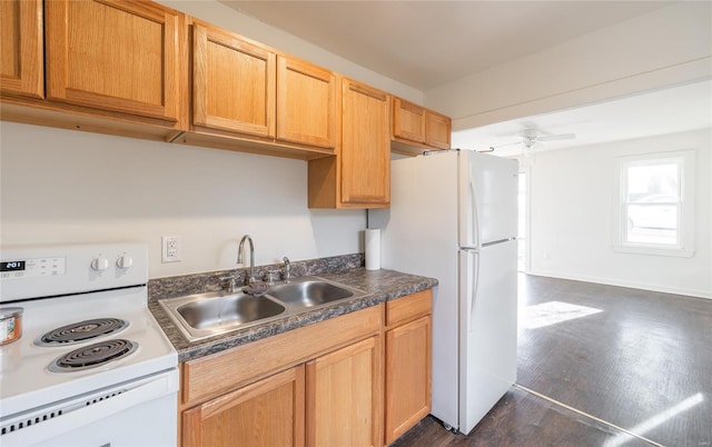 223 Warren St, Sullivan, MO 63080 - kitchen featuring white appliances, a sink, dark countertops, and dark wood-style floors