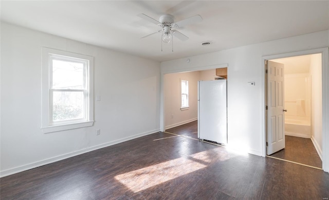 223 Warren St, Sullivan, MO 63080 - unfurnished bedroom featuring freestanding refrigerator, wood finished floors, and baseboards