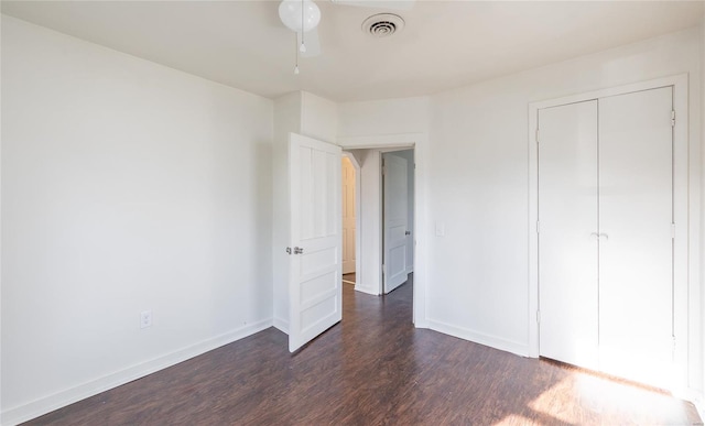 223 Warren St, Sullivan, MO 63080 - unfurnished bedroom featuring dark wood-style flooring, baseboards, a closet, and ceiling fan