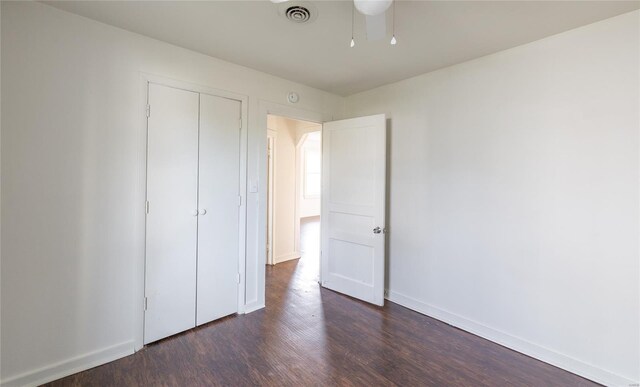 223 Warren St, Sullivan, MO 63080 - unfurnished bedroom with dark wood-style flooring, baseboards, and a closet
