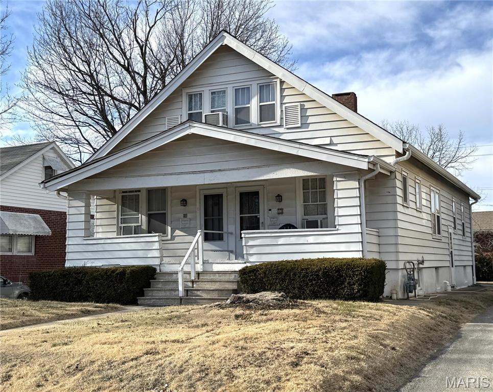 31 S 88th St, Belleville, IL 62223 - view of front of home featuring a chimney and covered porch