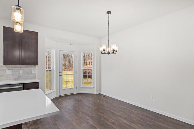 209 Red Fox Ct, Eureka, MO 63025 - unfurnished dining area with a chandelier, dark wood-style floors, and healthy amount of natural light