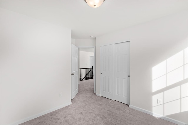 209 Red Fox Ct, Eureka, MO 63025 - unfurnished bedroom featuring carpet flooring, baseboards, and a closet