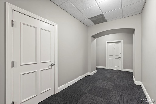 1515 Lafayette Ave Unit 316, Saint Louis, MO 63104 - hall featuring arched walkways, dark colored carpet, baseboards, and a paneled ceiling