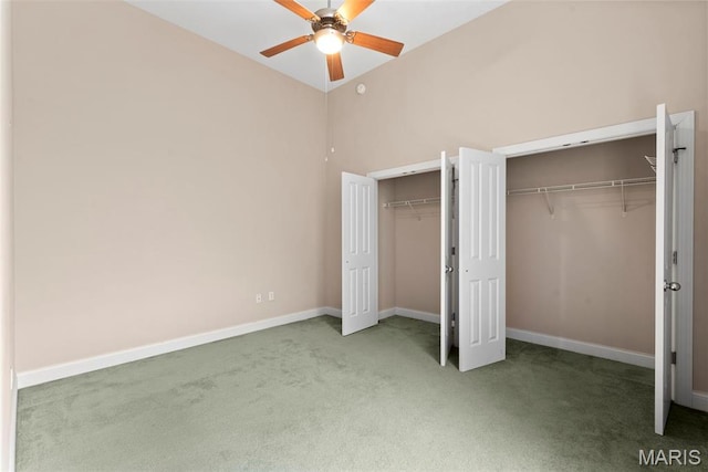 1515 Lafayette Ave Unit 316, Saint Louis, MO 63104 - unfurnished bedroom featuring carpet flooring, multiple closets, lofted ceiling, baseboards, and a ceiling fan