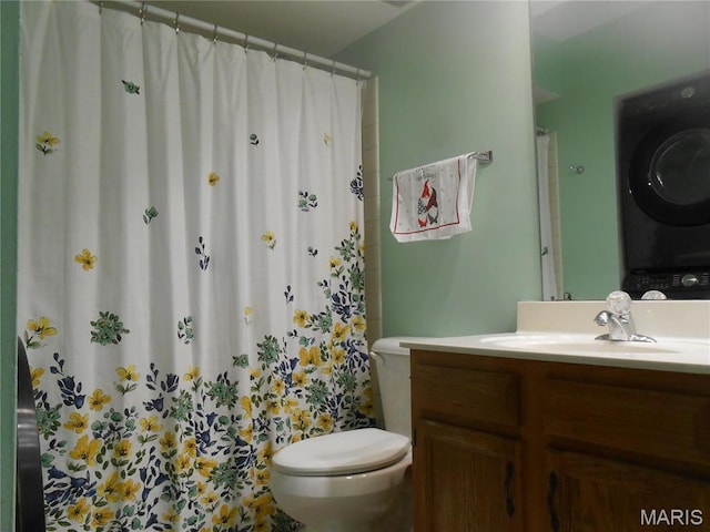 12954 Bryce Canyon Dr Unit E, Maryland Heights, MO 63043 - full bath with estacked washer and dryer, toilet, vanity, and curtained shower