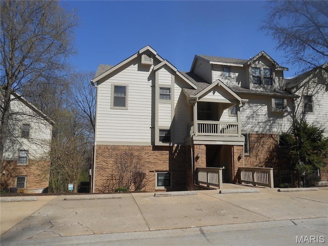 12954 Bryce Canyon Dr Unit E, Maryland Heights, MO 63043 - view of front of property with brick siding and a balcony