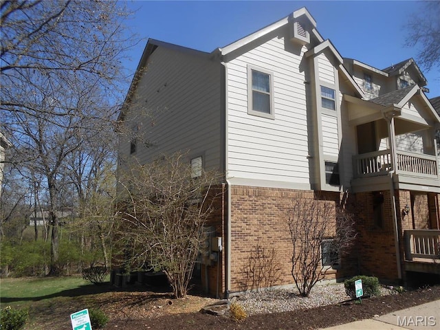 12954 Bryce Canyon Dr Unit E, Maryland Heights, MO 63043 - view of side of home with brick siding and a balcony