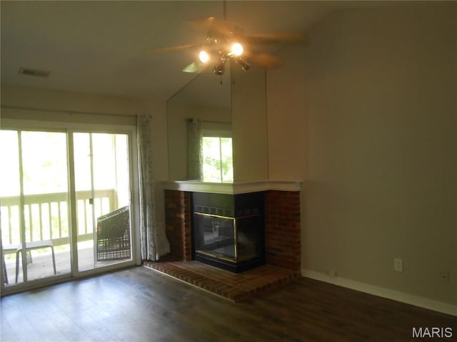 12954 Bryce Canyon Dr Unit E, Maryland Heights, MO 63043 - unfurnished living room with ceiling fan, wood finished floors, and a brick fireplace