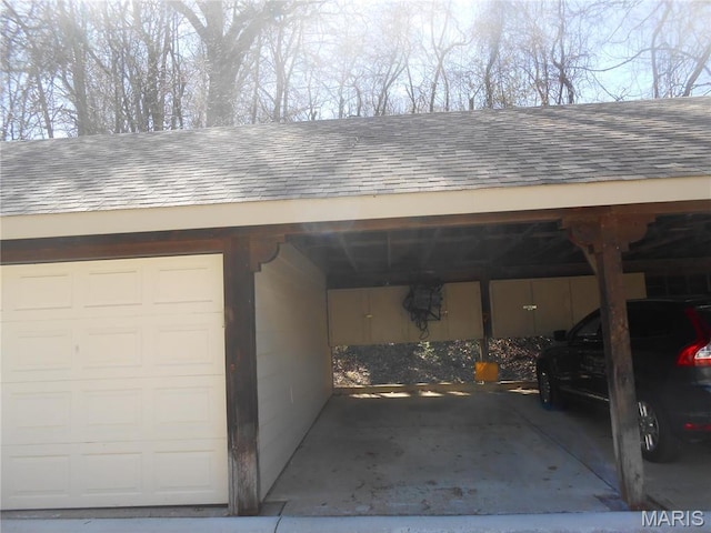 12954 Bryce Canyon Dr Unit E, Maryland Heights, MO 63043 - garage featuring a carport