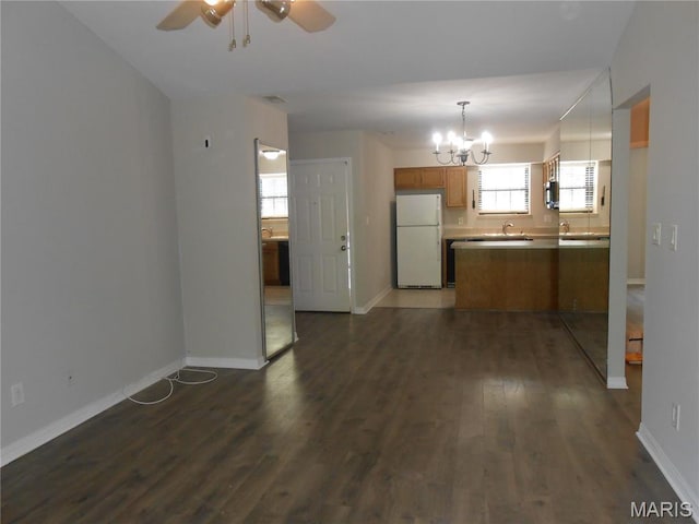 12954 Bryce Canyon Dr Unit E, Maryland Heights, MO 63043 - kitchen with freestanding refrigerator, a chandelier, dark wood finished floors, a ceiling fan, and brown cabinets